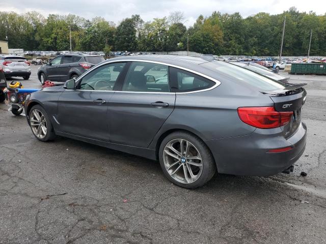 WBA8Z9C57JG827701 - 2018 BMW 330 XIGT GRAY photo 2