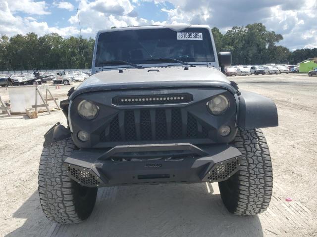 1C4BJWDG2GL189047 - 2016 JEEP WRANGLER U SPORT Silber Foto 5