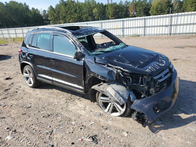 WVGBV3AX2EW101290 - 2014 VOLKSWAGEN TIGUAN S BLACK photo 4