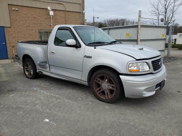 2FTRF07364CA64614 - 2004 FORD F150 SVT LIGHTNING SILVER photo 4