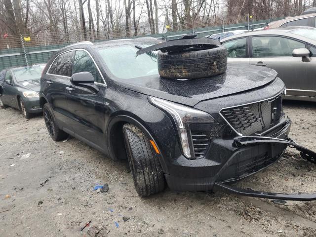 1GYFZBR4XPF127552 - 2023 CADILLAC XT4 LUXURY BLACK photo 4