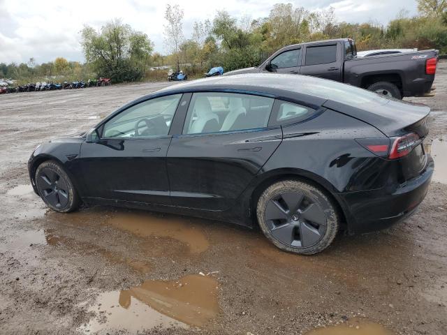 5YJ3E1EA4PF394250 - 2023 TESLA MODEL 3 Schwarz Foto 2