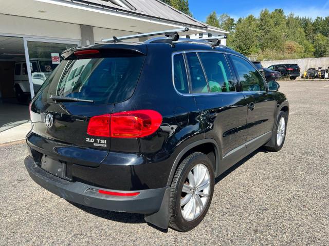 WVGBV7AX5CW608902 - 2012 VOLKSWAGEN TIGUAN S BLACK photo 4