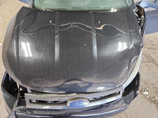 1FAHP3GN6AW198587 - 2010 FORD FOCUS SES BLACK photo 11