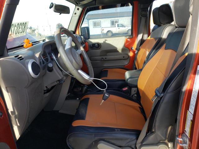 1J4GA59169L741196 - 2009 JEEP WRANGLER U SAHARA ORANGE photo 7