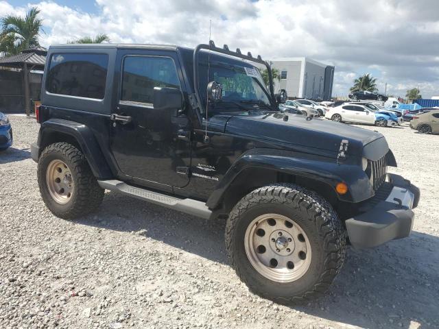 1J4GA5D16BL550388 - 2011 JEEP WRANGLER SAHARA შავი ფოტო 4