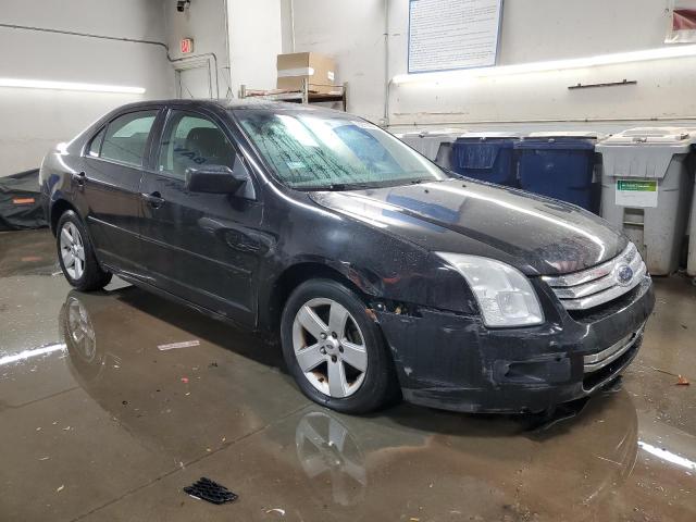 3FAHP07Z28R228957 - 2008 FORD FUSION SE BLACK photo 4