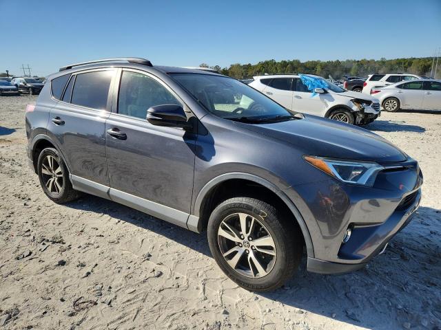 JTMWFREV5HD101170 - 2017 TOYOTA RAV4 XLE ნაცრისფერი ფოტო 4