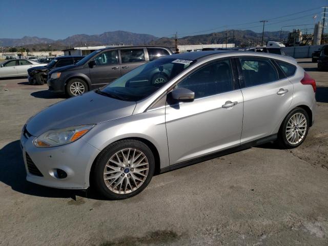 1FADP3N29EL423289 - 2014 FORD FOCUS TITANIUM SILVER photo 1