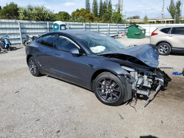 5YJ3E1EA3PF385989 - 2023 TESLA MODEL 3 GRAY photo 4