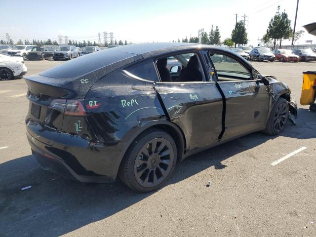 7SAYGDEE4PF907889 - 2023 TESLA MODEL Y Schwarz Foto 3