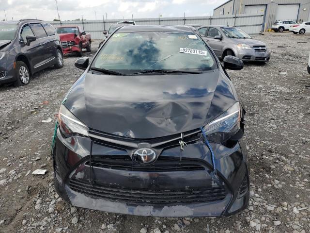 5YFBURHEXKP940168 - 2019 TOYOTA COROLLA L შავი ფოტო 5