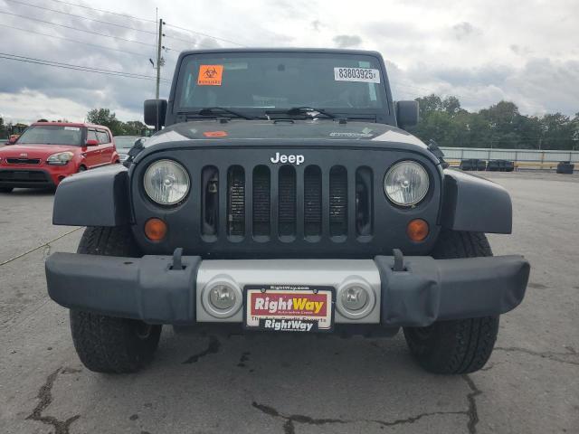 1C4BJWEG1CL179988 - 2012 JEEP WRANGLER U SAHARA შავი ფოტო 5