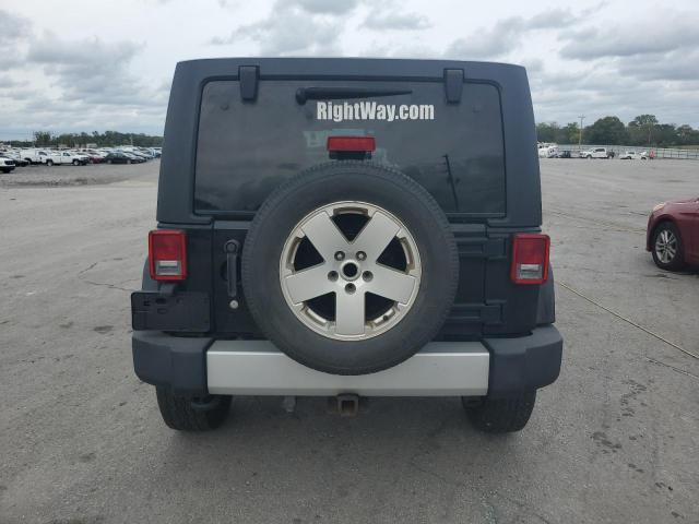 1C4BJWEG1CL179988 - 2012 JEEP WRANGLER U SAHARA შავი ფოტო 6