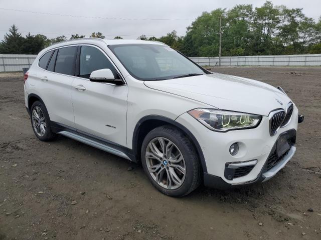 WBXHT3Z39H4A57820 - 2017 BMW X1 XDRIVE28I WHITE photo 4