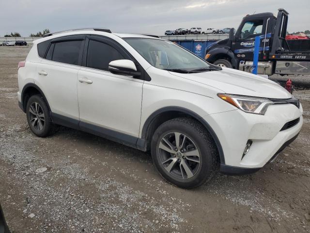 JTMWFREV0HJ111025 - 2017 TOYOTA RAV4 XLE WHITE photo 4