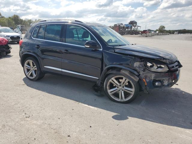 WVGBV3AX2EW031578 - 2014 VOLKSWAGEN TIGUAN S BLACK photo 4