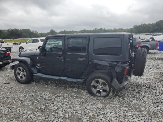 1C4BJWEG2EL142631 - 2014 JEEP WRANGLER U SAHARA BLACK photo 2