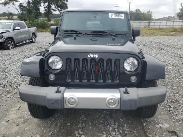 1C4BJWEG2EL142631 - 2014 JEEP WRANGLER U SAHARA BLACK photo 5