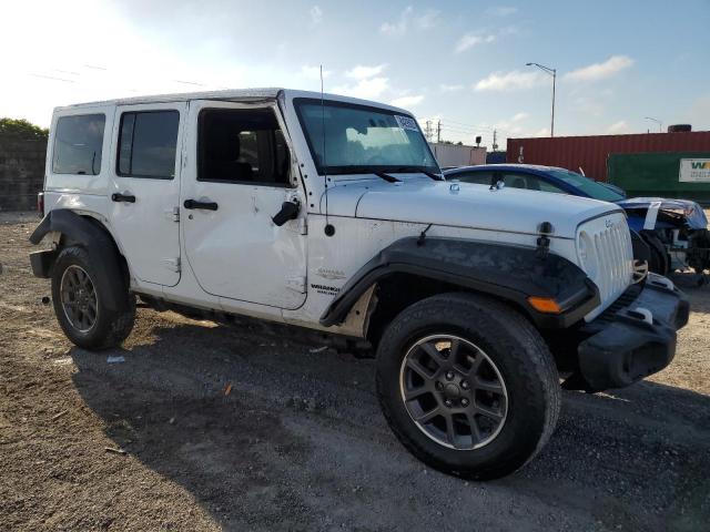 1J4BA5H19BL567318 - 2011 JEEP WRANGLER U SAHARA WHITE photo 4