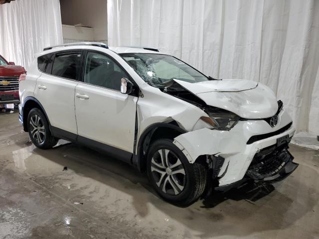 JTMBFREV7GJ063648 - 2016 TOYOTA RAV4 LE WHITE photo 4
