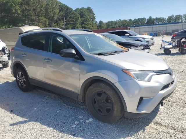 2T3ZFREV6GW311209 - 2016 TOYOTA RAV4 LE SILVER photo 4