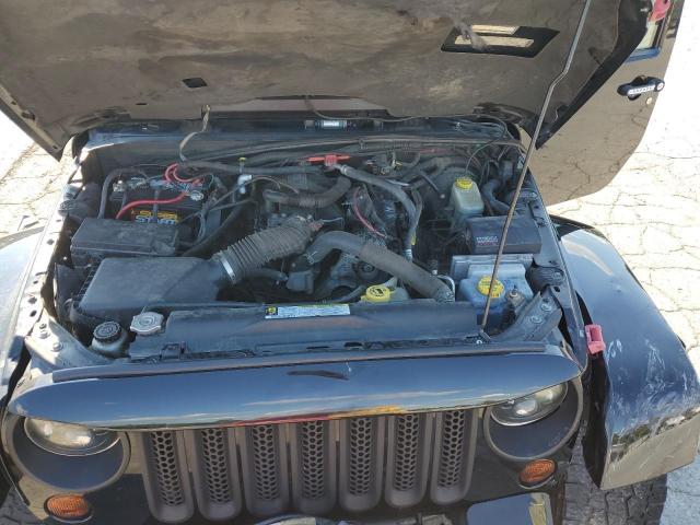 1J4BA5H17AL144056 - 2010 JEEP WRANGLER U SAHARA Чорний фото 12