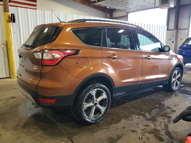 1FMCU9G93HUD48207 - 2017 FORD ESCAPE SE ORANGE photo 3