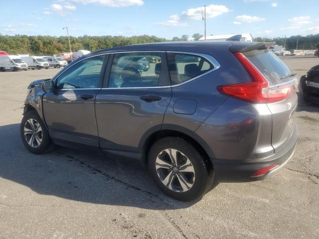 2HKRW6H32KH217711 - 2019 HONDA CR-V LX SILVER photo 2