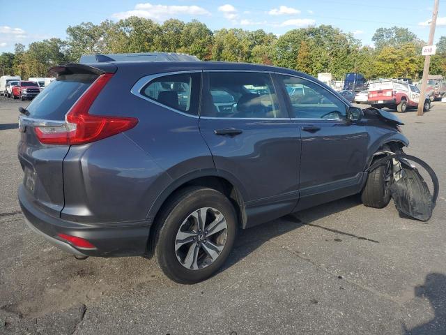 2HKRW6H32KH217711 - 2019 HONDA CR-V LX SILVER photo 3