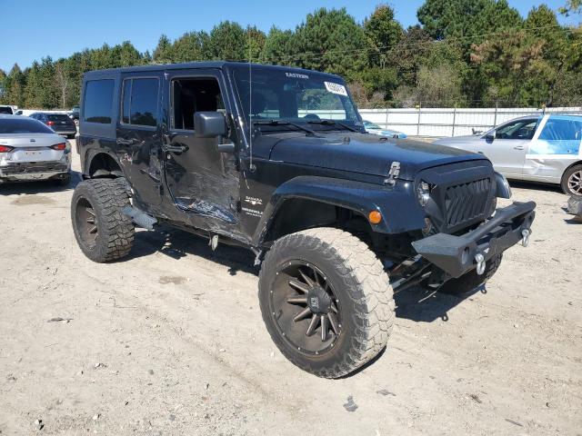 1C4BJWEG0GL103944 - 2016 JEEP WRANGLER U SAHARA Schwarz Foto 4