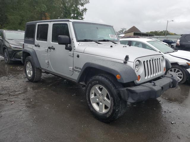 1J4HA3H13BL551212 - 2011 JEEP WRANGLER U SPORT Silber Foto 4