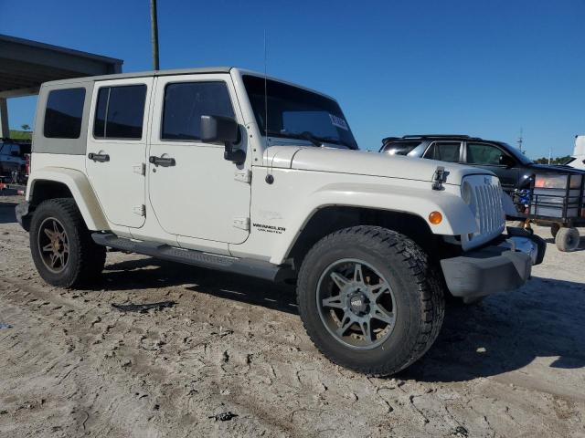1J4HA5H19AL195181 - 2010 JEEP WRANGLER U SAHARA WHITE photo 4