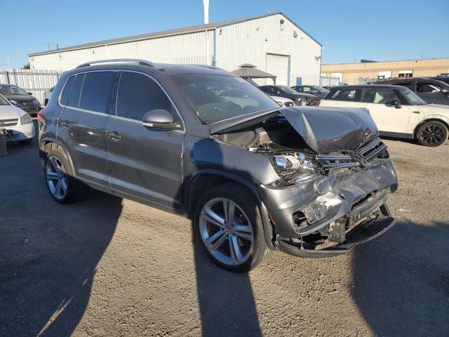 WVGJV3AX0EW026391 - 2014 VOLKSWAGEN TIGUAN S GRAY photo 4