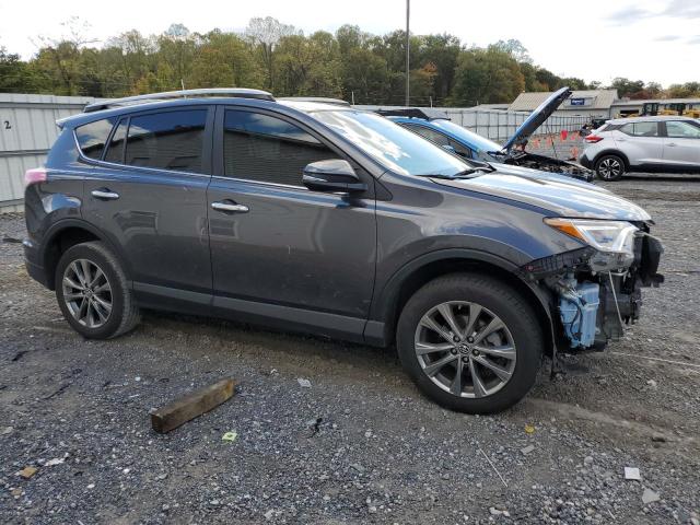 JTMDFREV5JJ175848 - 2018 TOYOTA RAV4 LIMITED GRAY photo 4