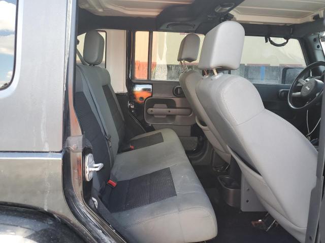 1J4BA5H12AL104094 - 2010 JEEP WRANGLER U SAHARA BLACK photo 10