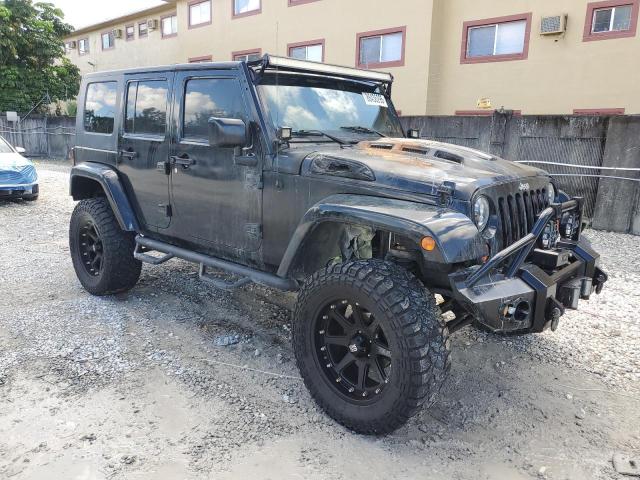 1J4BA5H12AL104094 - 2010 JEEP WRANGLER U SAHARA BLACK photo 4