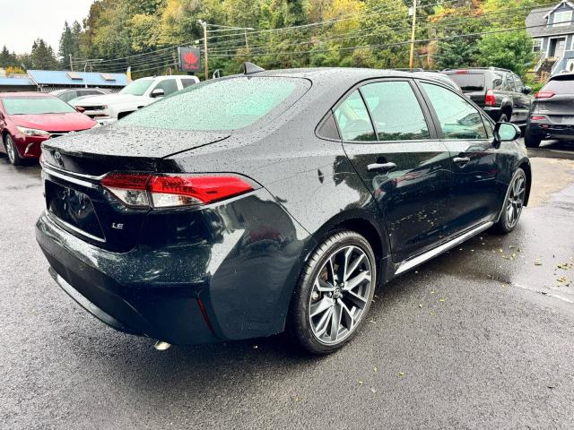 5YFEPMAE2MP174215 - 2021 TOYOTA COROLLA LE BLACK photo 4