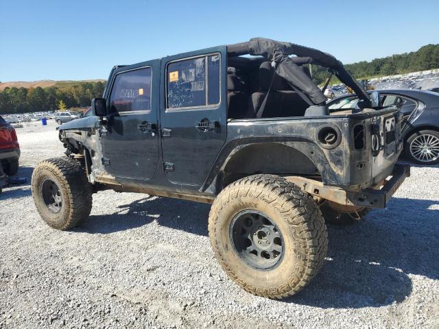 1C4BJWEG0CL163460 - 2012 JEEP WRANGLER U SAHARA BLACK photo 2