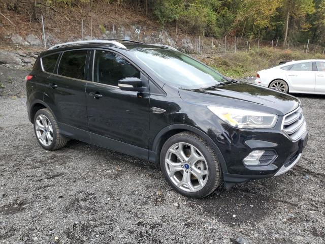 1FMCU0J90HUB64587 - 2017 FORD ESCAPE TITANIUM BLACK photo 4