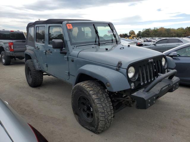 1C4BJWDG1EL311412 - 2014 JEEP WRANGLER U SPORT Gris photo 4