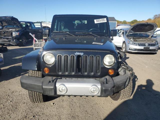 1C4HJWEG5CL202201 - 2012 JEEP WRANGLER UNLIMITED SAHARA შავი ფოტო 5