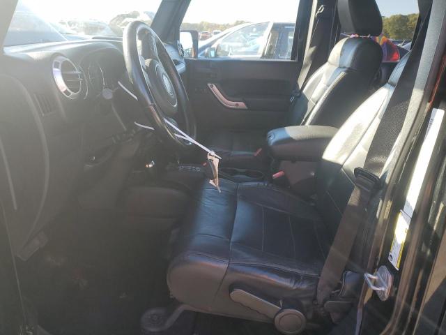 1C4HJWEG5CL202201 - 2012 JEEP WRANGLER UNLIMITED SAHARA შავი ფოტო 7