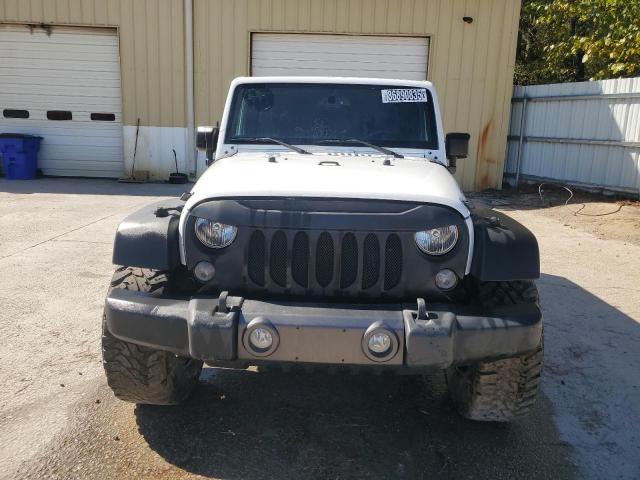 1C4HJWDG2GL121454 - 2016 JEEP WRANGLER U SPORT Белый фото 5