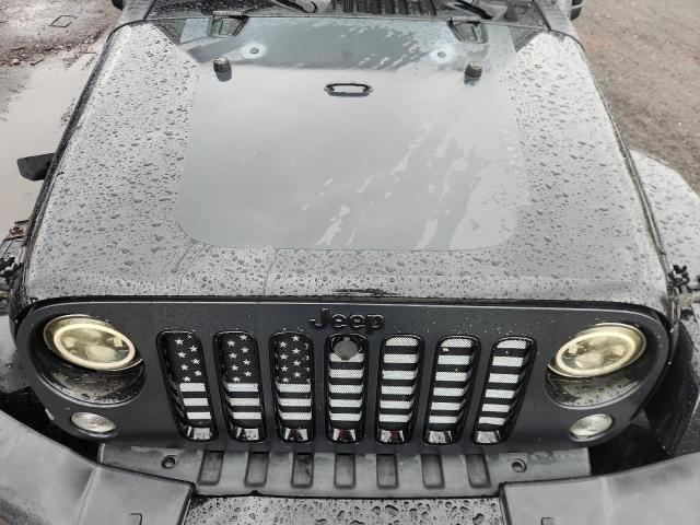 1C4BJWEG1EL254773 - 2014 JEEP WRANGLER U SAHARA შავი ფოტო 12