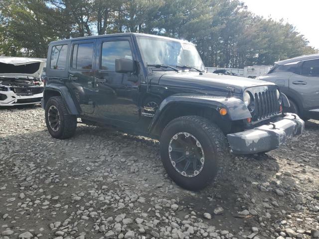 1J4BA5H11AL153027 - 2010 JEEP WRANGLER U SAHARA BLACK photo 4