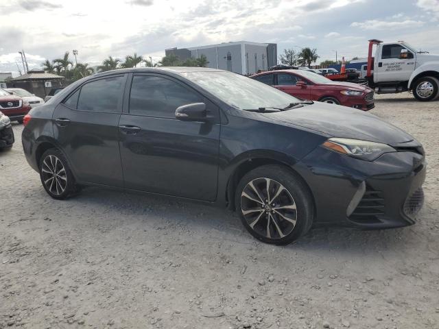 5YFBURHE3JP760142 - 2018 TOYOTA COROLLA L BLACK photo 4