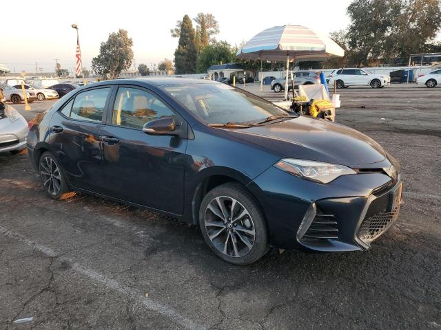 5YFBURHE3JP801224 - 2018 TOYOTA COROLLA L TEAL photo 4