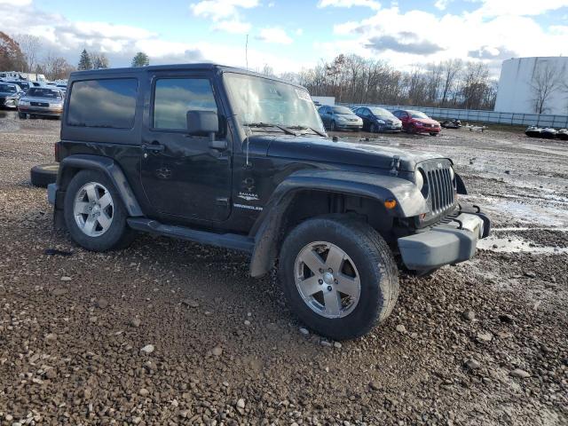 1J4FA541X9L756724 - 2009 JEEP WRANGLER SAHARA შავი ფოტო 4