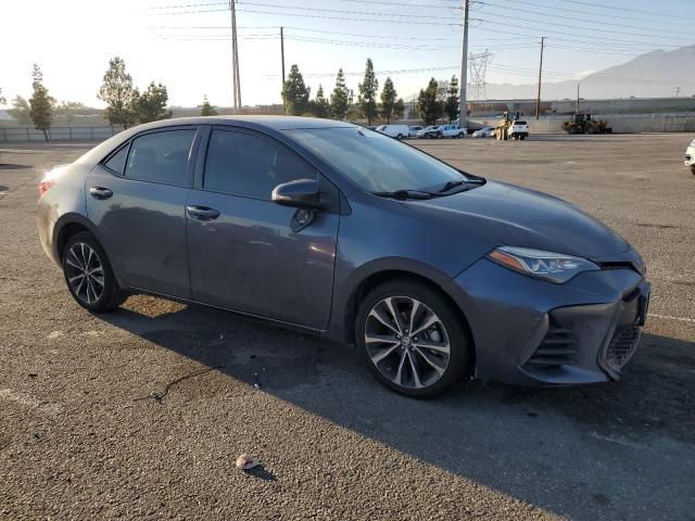 5YFBURHE1KP893631 - 2019 TOYOTA COROLLA L ნაცრისფერი ფოტო 4